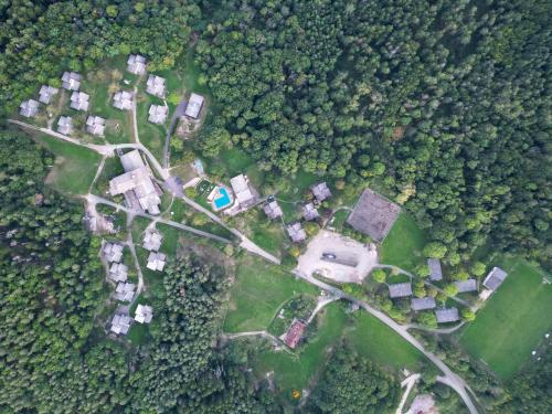 an aerial view of a park with houses and trees at Hôtel parc & spa Les cigognes in Albé