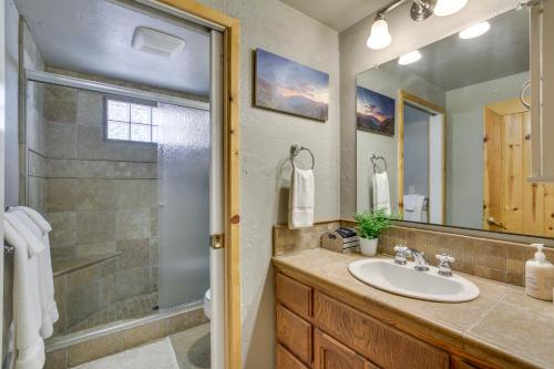 a bathroom with a sink and a shower at Central Big Bear Lake Retreat with Private Hot Tub! in Big Bear Lake