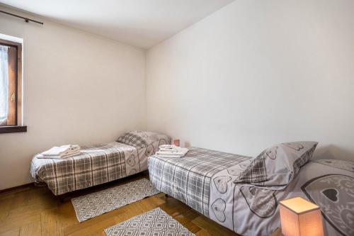 Katil atau katil-katil dalam bilik di Appartamento Trentin