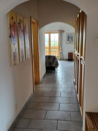 a hallway with a tile floor in a house at Apartment Ferienwohnung Maissen by Interhome in Lenz
