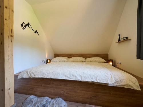a bedroom with a bed in a attic at Holiday Home Muhu by Interhome in Smržovka