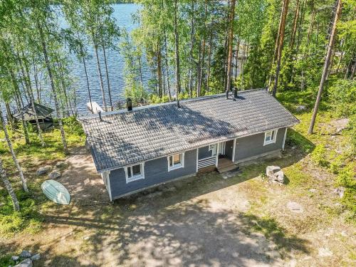 an overhead view of a small house in the woods at Holiday Home Aurinkokaari by Interhome in Heinävesi