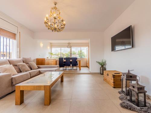 a living room with a couch and a table at Holiday Home Cibada by Interhome in Pobla de Montornés