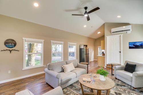 a living room with two couches and a table at 20 Mi to Glacier Natl Park Pet-Friendly Cabin in Columbia Falls