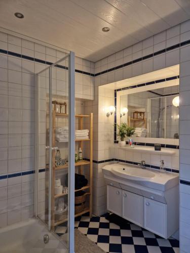 a bathroom with a sink and a mirror at Landhaus Domaine de Marie in Illingen