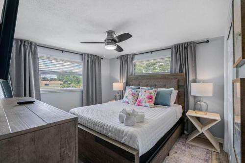 a bedroom with a large bed and a window at Clearwater 2 story pool home mins from the beach in Clearwater
