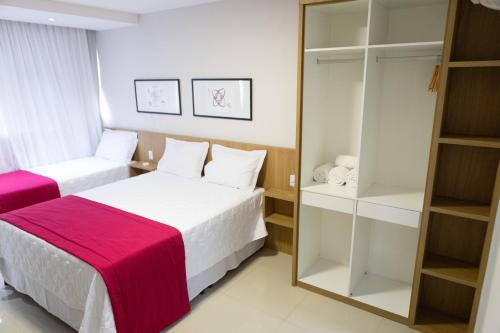 Uma cama ou camas num quarto em Daho Hotel