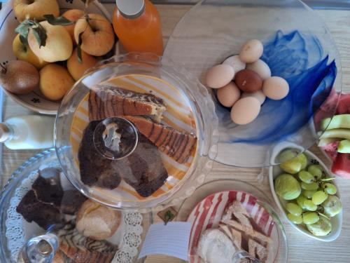 a table with a bunch of different types of food at Residenza Anima Mediterranea in Francavilla Fontana