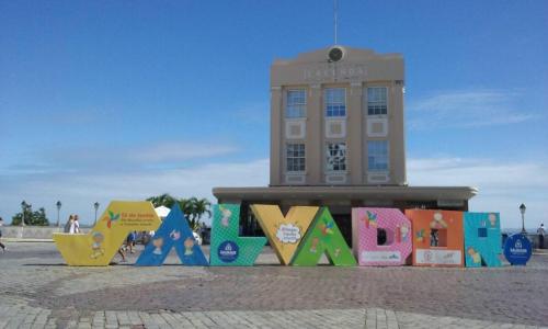 a building with a sign in front of it at Apartamento Pelourinho in Salvador