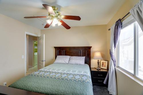 a bedroom with a bed and a ceiling fan at North Las Vegas Home about 5 Mi to Fremont St! in Las Vegas