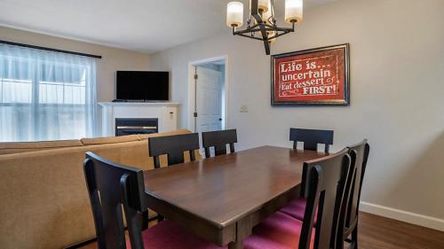 a dining room with a table and a couch at Bluegreen Vacations Suites at Hershey in Hershey