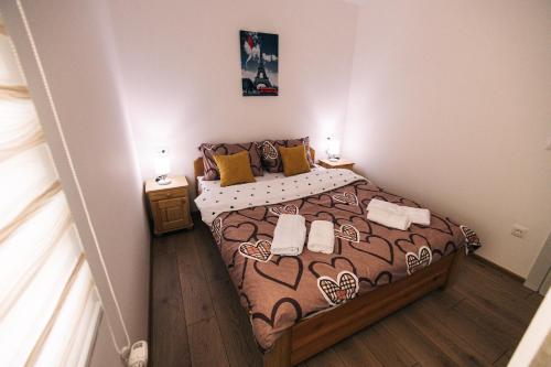 a bedroom with a large bed in a room at Jelenin konak in Nova Varoš