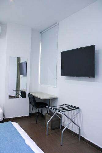 TV a/nebo společenská místnost v ubytování BGA Hotel