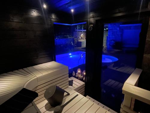 a house with a swimming pool in the dark at Nofesh Ba Alon 10 in Rosh Pinna