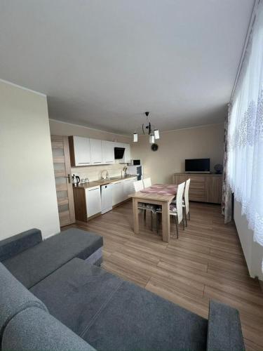 Apartament na Słonecznej tesisinde bir oturma alanı