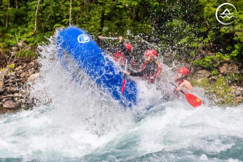 two people are in a raft in a river at Rafting Center "TARA-RAFT" in Bastasi