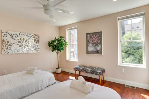 two beds in a room with two windows at Chic Philadelphia Townhome in University City! in Philadelphia