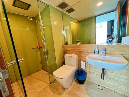 a bathroom with a toilet and a sink at Vortex suites near by KLCC in Kuala Lumpur