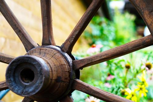 a close up of the spokes of a wooden wagon wheel at Ada in Rimavská Sobota