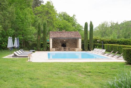 The swimming pool at or close to Château Forge du Roy