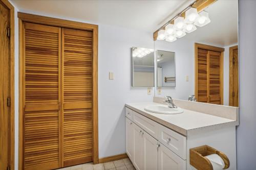 a bathroom with a sink and a mirror at Highridge B16A Hotel Room Only, Delightful hotel room, sleeps 2 in Killington