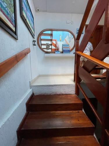 a set of stairs in a boat with a mirror at La Posada De Lulú in San Andrés