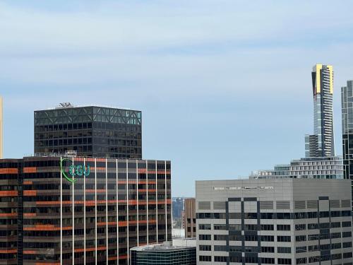 a group of tall buildings in a city at Quiet CBD 3b2b apartment + free parking in Melbourne