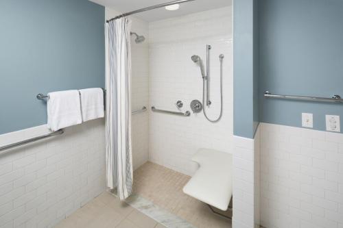 a bathroom with a shower and a toilet at Andover Inn in Andover