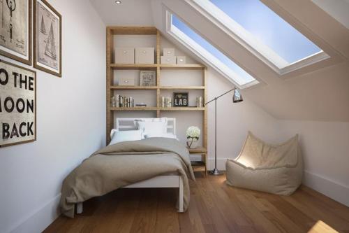 a bedroom with a bed and a skylight at Shakespeare inn in London