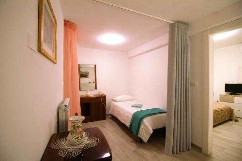 Tempat tidur dalam kamar di B&B La Zia - Manoppello