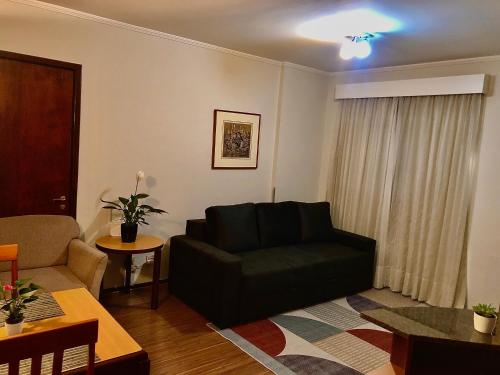 Χώρος καθιστικού στο Apartamento completo no Batel