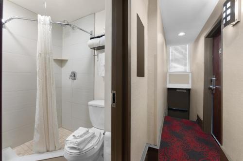 a bathroom with a toilet and a shower at Quality Inn Center City Philadelphia in Philadelphia