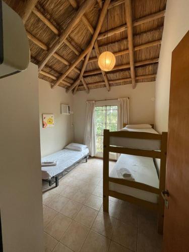 a room with two bunk beds and a window at don isidro cabaña alta in La Paz