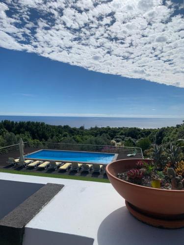 a view of a pool from the balcony of a house at Quinta de Santo António in Fonte Bastardo