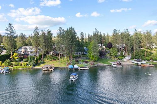 an aerial view of a lake with boats in it at Luxe Lake Home Reflect Recharge and Reconnect in Nine Mile Falls