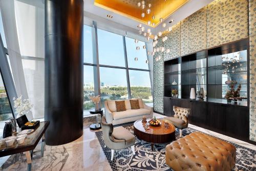 a living room with a couch and a table at Conrad Abu Dhabi Etihad Towers in Abu Dhabi