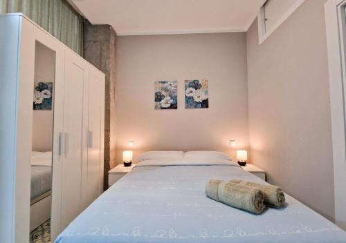 Ένα ή περισσότερα κρεβάτια σε δωμάτιο στο Apartamentos Manzanares 'Madrid Rio'