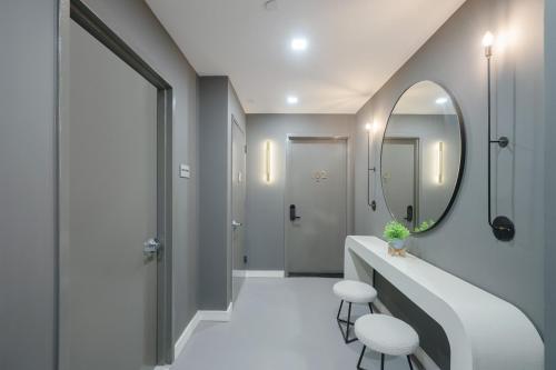 a bathroom with a sink and a mirror at Unbeatable 3BR with Private Patio in Upper East Side in New York