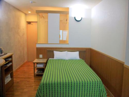 Postel nebo postele na pokoji v ubytování HOTEL 紅-bin-