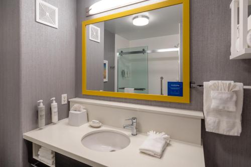 a bathroom with a sink and a mirror at Hampton Inn & Suites Agoura Hills in Agoura Hills