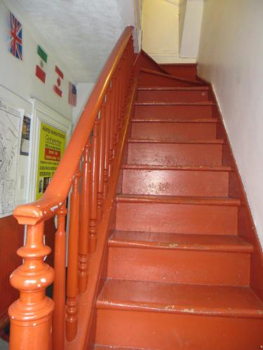 a set of stairs in a building with red steps at Auberge Jeunesse La Belle Planete Backpackers Hostel in Quebec City