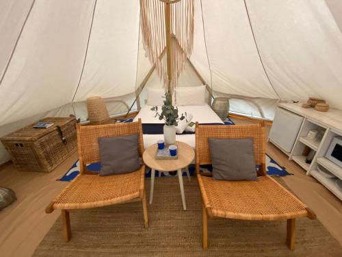 a room with a table and chairs in a tent at Halls Gap Lakeside Tourist Park in Halls Gap