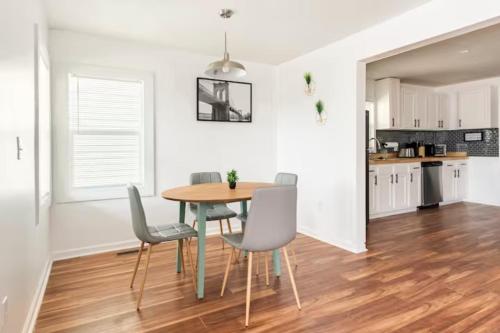 a kitchen and dining room with a table and chairs at A Place to Escape 5 minutes from Downtown Newly Renovated in Birmingham