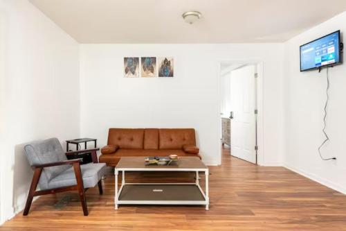 a living room with a couch and a coffee table at A Place to Escape 5 minutes from Downtown Newly Renovated in Birmingham
