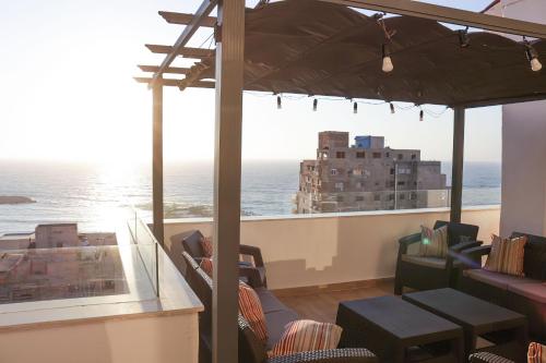 a restaurant with a view of the ocean at Nabeel Homes - Seaview Rooftop - San Stefano in Alexandria