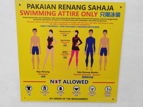 a sign on a wall that says not allowed at Monstera Meritus Homestay - Penang Butterworth Prai 1-8PAX in Perai