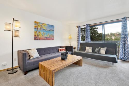a living room with a couch and a coffee table at 2341-Bear Meadow Woods Condo condo in Big Bear Lake