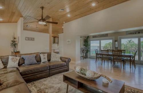 a living room with a couch and a table at Relaxing 2 2 Get Away in the Lower Keys! home in Summerland Key