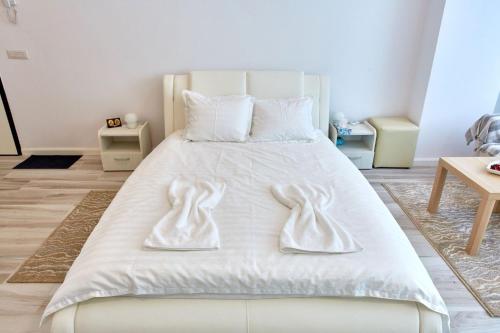 En eller flere senge i et værelse på Studio Bel Air Paradise