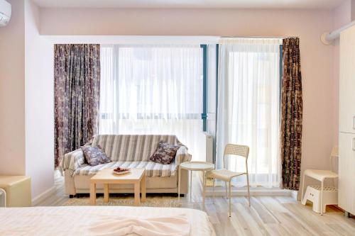 En eller flere senge i et værelse på Studio Bel Air Paradise